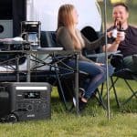 Anker F2600 power station with solar panel providing energy for cooking and lighting during a camping trip, supplied by UPS Equip.