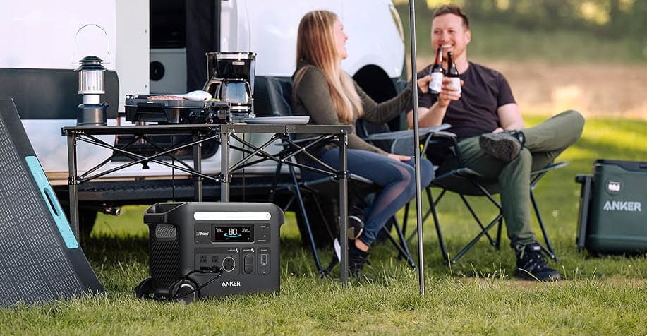 Anker F2600 power station with solar panel providing energy for cooking and lighting during a camping trip, supplied by UPS Equip.