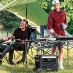 Anker F2600 power station providing energy for cooking and lighting during an outdoor camping setup, supplied by UPS Equip.